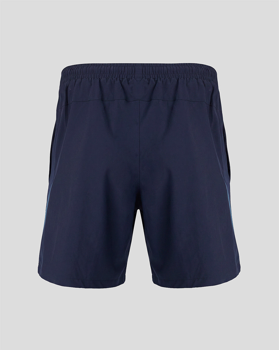 Back view of navy training shorts with elastic waistband and blue side panels.