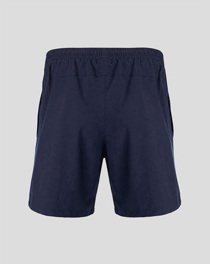 Back view of navy training shorts with elastic waistband and blue side panels.