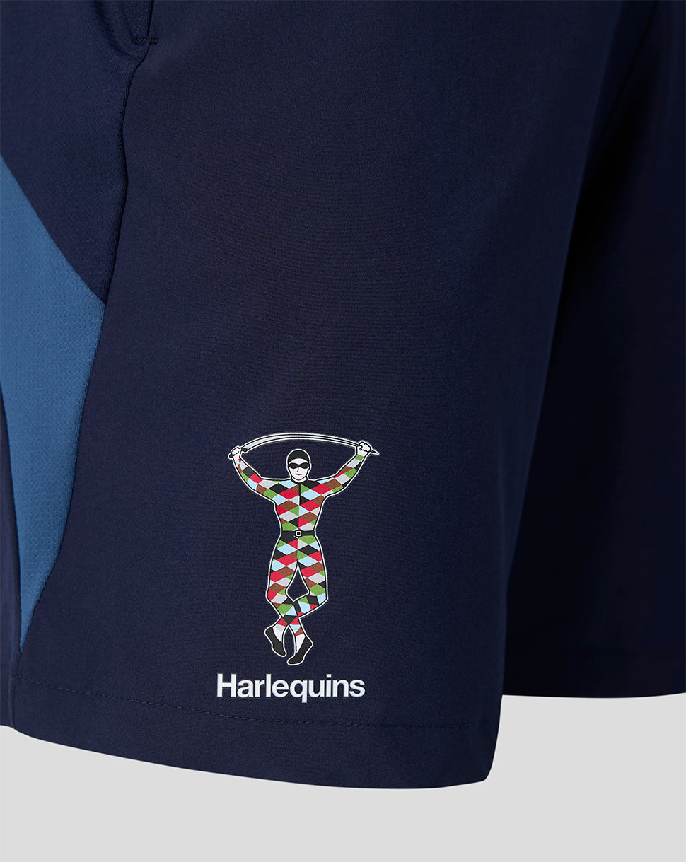 Close-up of Harlequins logo on the left leg of navy training shorts.