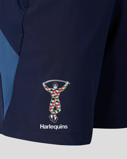 Close-up of Harlequins logo on the left leg of navy training shorts.