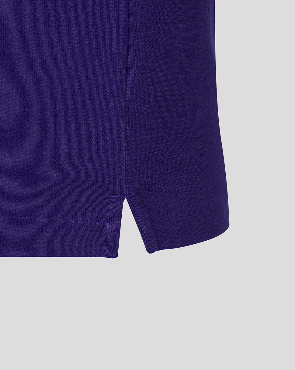 Close-up of the hem on a Rhodonite England Rugby Women’s 26/27 long sleeve shirt with a small side vent.