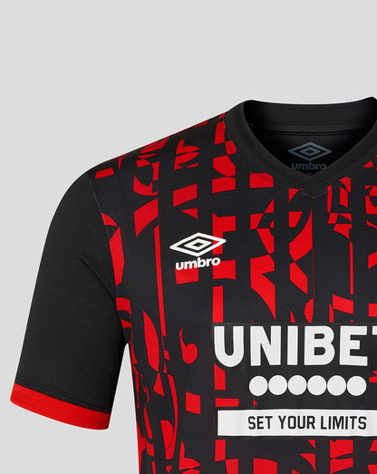 Rangers FC third Pro Shirt close-up with crest near chest, Umbro logo at the neck, and bold red on black pattern with UNIBET across chest.