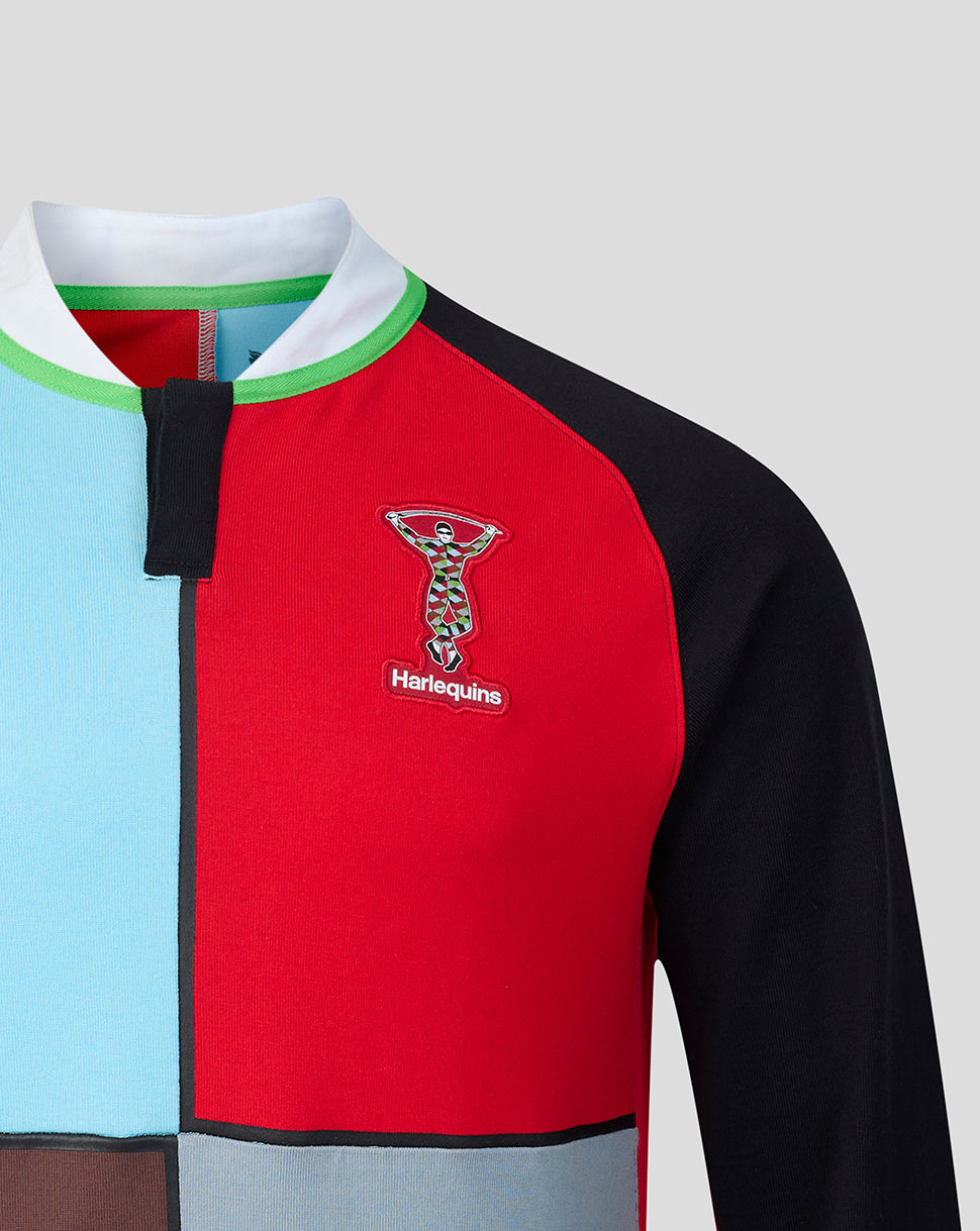 Harlequins home shirt close up with red chest panel blue side panel and crest on the fabric