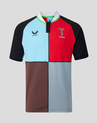 Color-blocked polo shirt with brand logos on a gray background