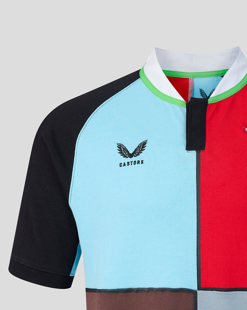 Color-blocked shirt with black, blue, red, and brown sections on a light gray background.