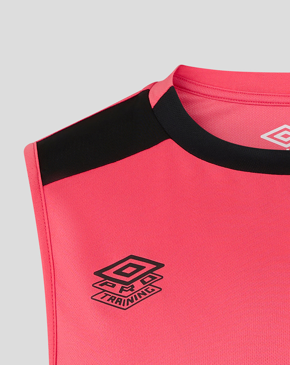 Close-up of a pink sports outfit with black trim and Umbro logo on a gray background