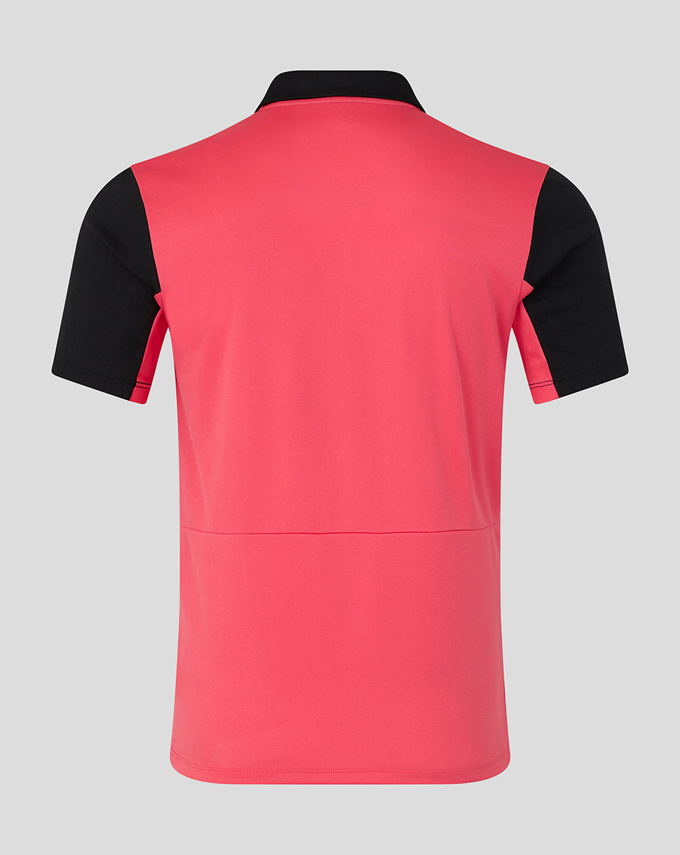 Red and black polo shirt on a gray background