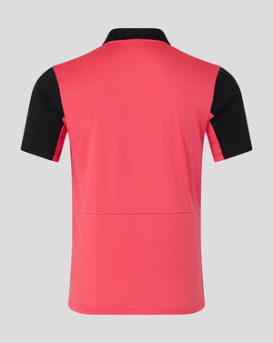 Red and black polo shirt on a gray background