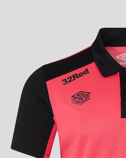 Pink polo shirt with black collar and sleeves, featuring '32Red' and Umbro logos on a light gray background.