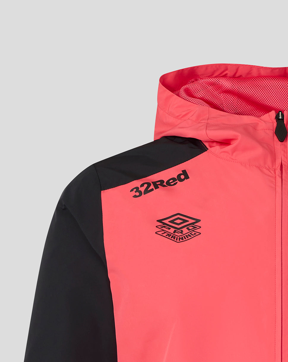 Pink and black jacket with '32Red' and Umbro logos on a light gray background