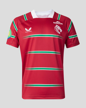 A red short-sleeve rugby jersey with green and white horizontal stripes, featuring the Castore logo on the right chest and the Bridson logo on the left chest, displayed on a neutral gray background.