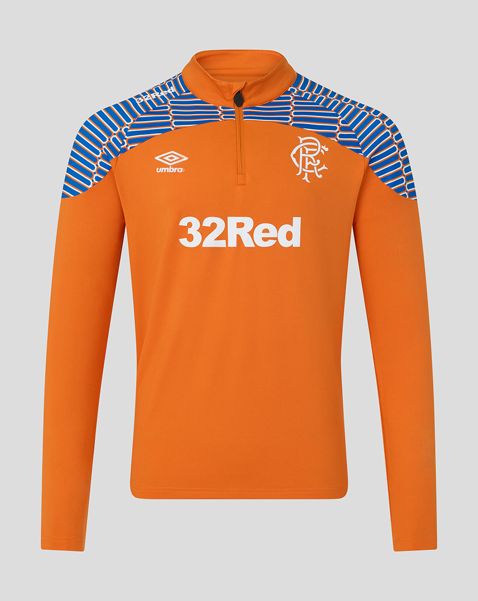 An orange long-sleeve half-zip athletic top with blue and white patterned shoulder panels, featuring the Umbro logo and Rangers FC crest on the chest.