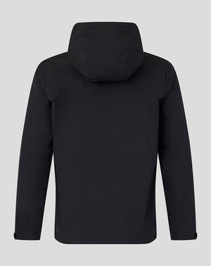 A black hooded jacket shown from the back, photographed against a solid light gray background.
