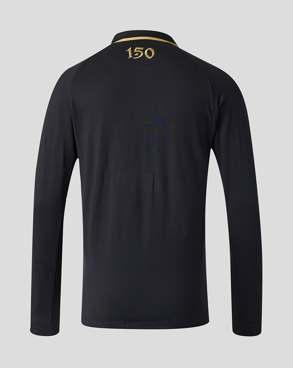 A long-sleeve black polo shirt shown from the back, featuring a gold '150' print on the collar and subtle tonal wave patterns across the back, set against a solid light gray background.