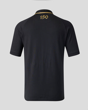 A black short-sleeve polo shirt shown from the back, featuring a gold embroidered collar stripe and the number '150' in gold near the top center.