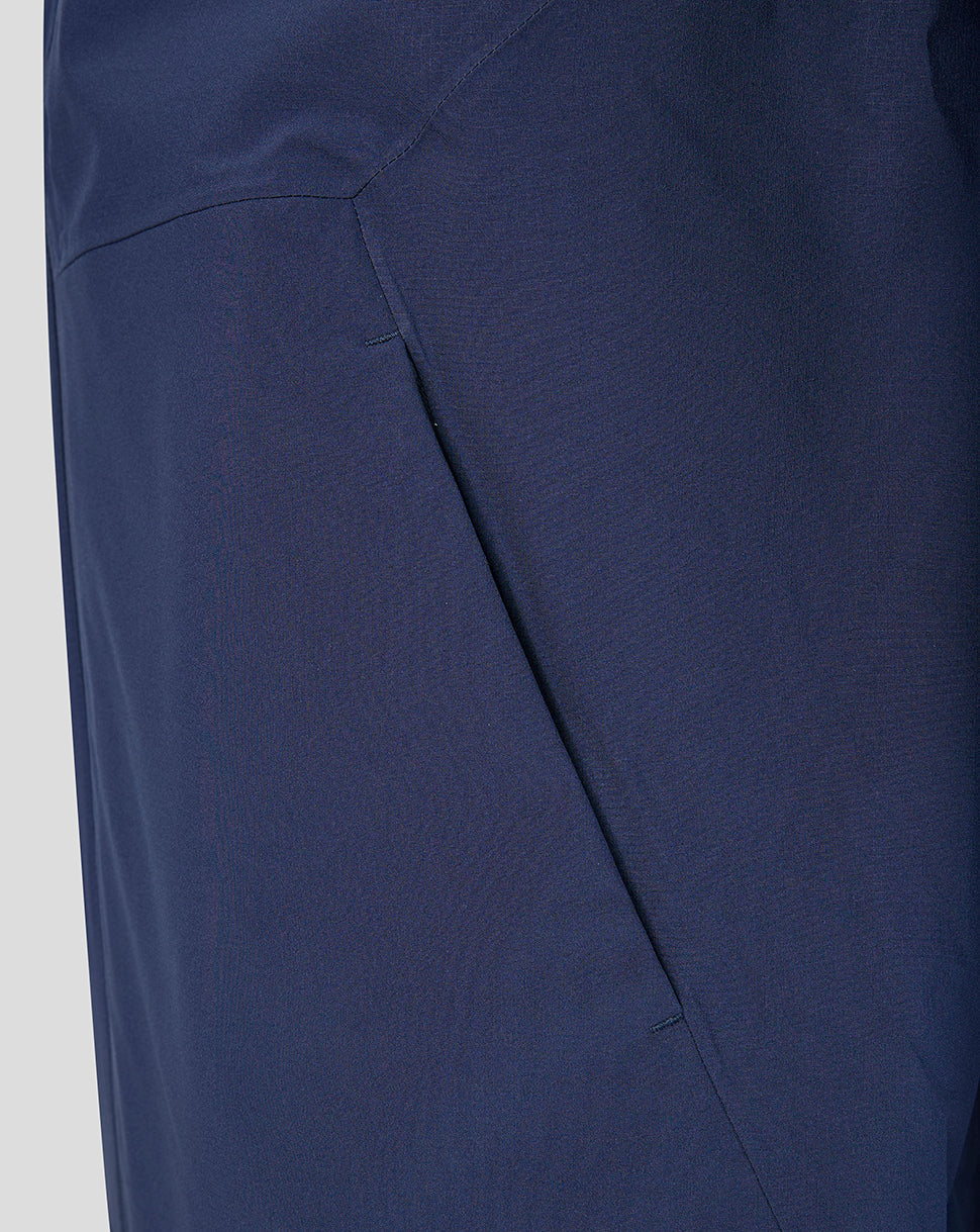 Close up of navy fabric and panel seam on the Harlequins training rain jacket