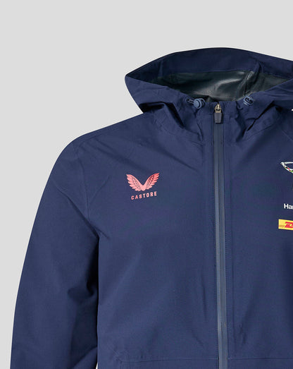 Close up of the navy training rain jacket front showing Castore logo on the left chest and Harlequins crest with DHL sponsor near the zipper