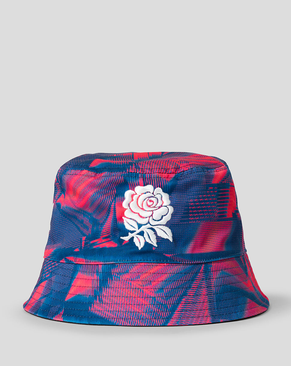 Reversible bucket hat in blue and pink graphic pattern with white rose embroidery on the front.