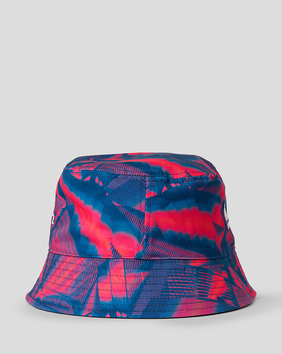 Reversible bucket hat with blue pink graphic pattern and white rose embroidery visible on the front.