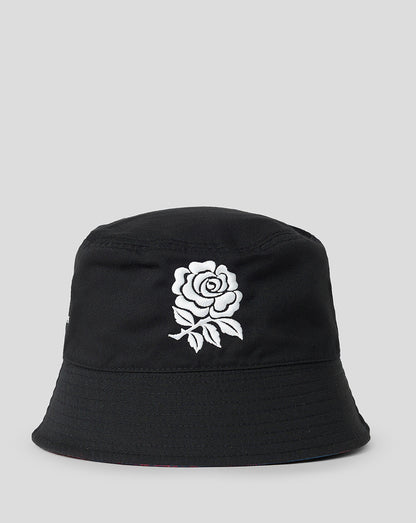 Black reversible bucket hat with white rose embroidery on the front.