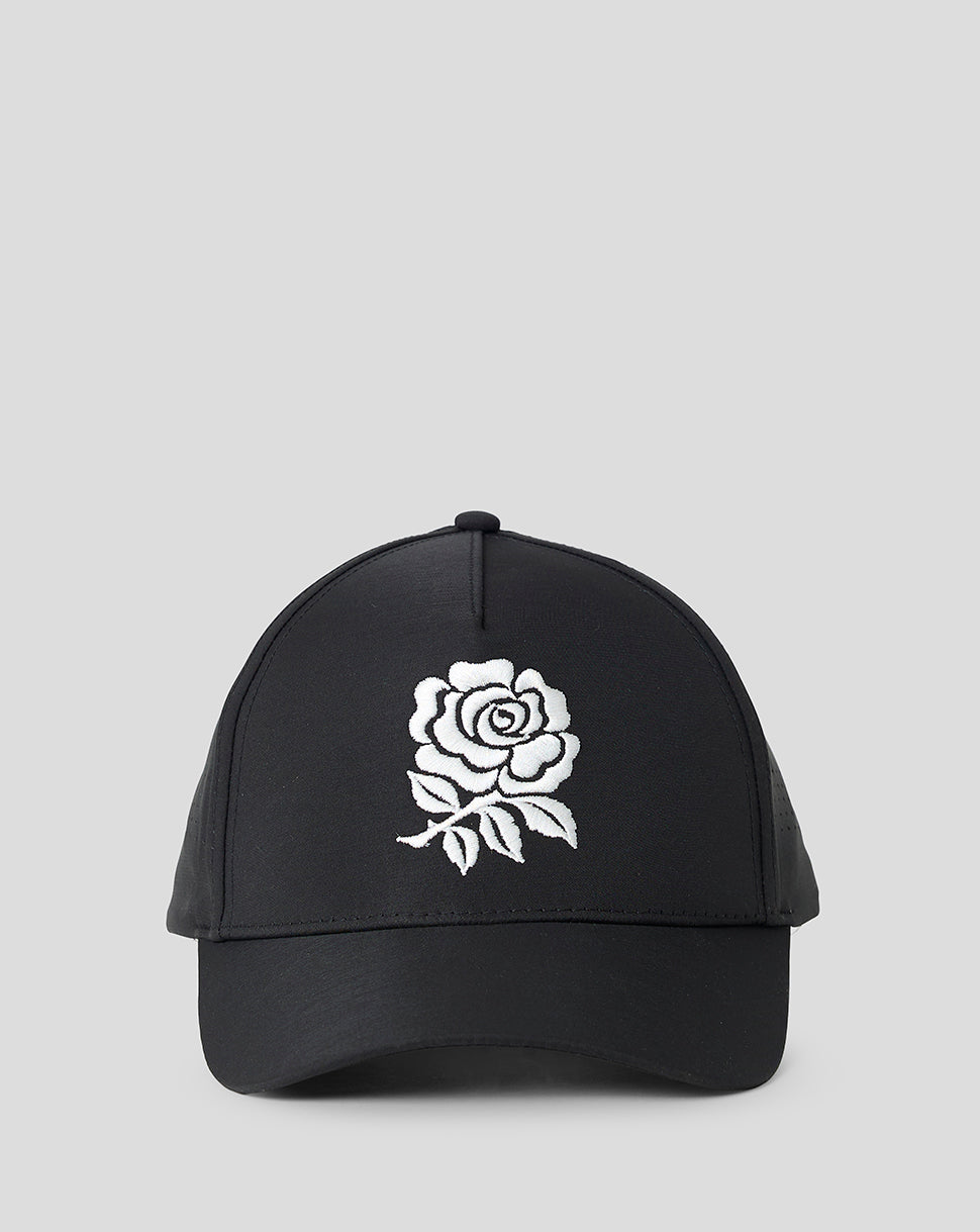 Black cap with a white rose design on a light gray background