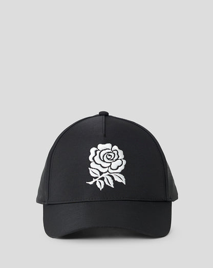 Black cap with a white rose design on a light gray background