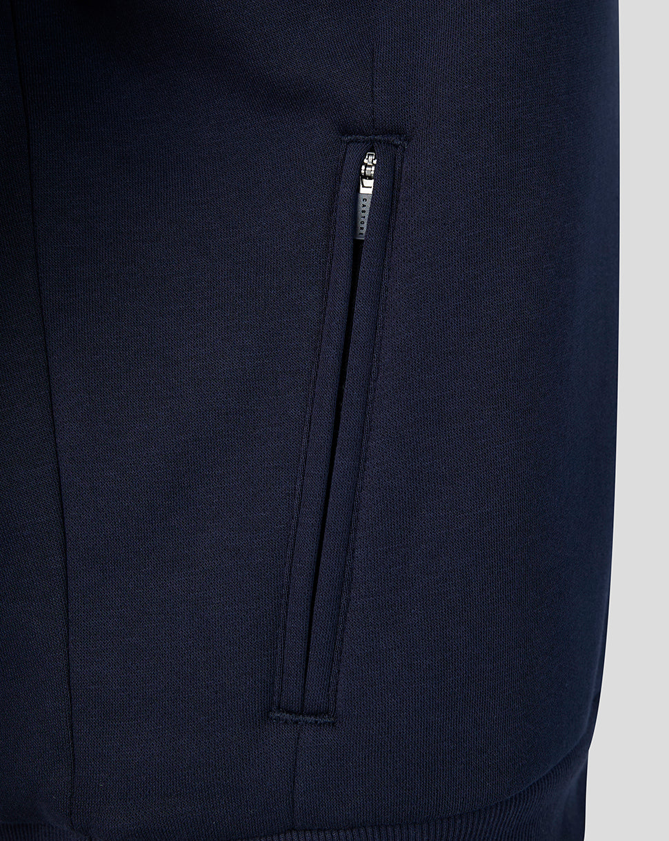 Close-up of navy Travel Hoodie pocket with vertical zip on the side