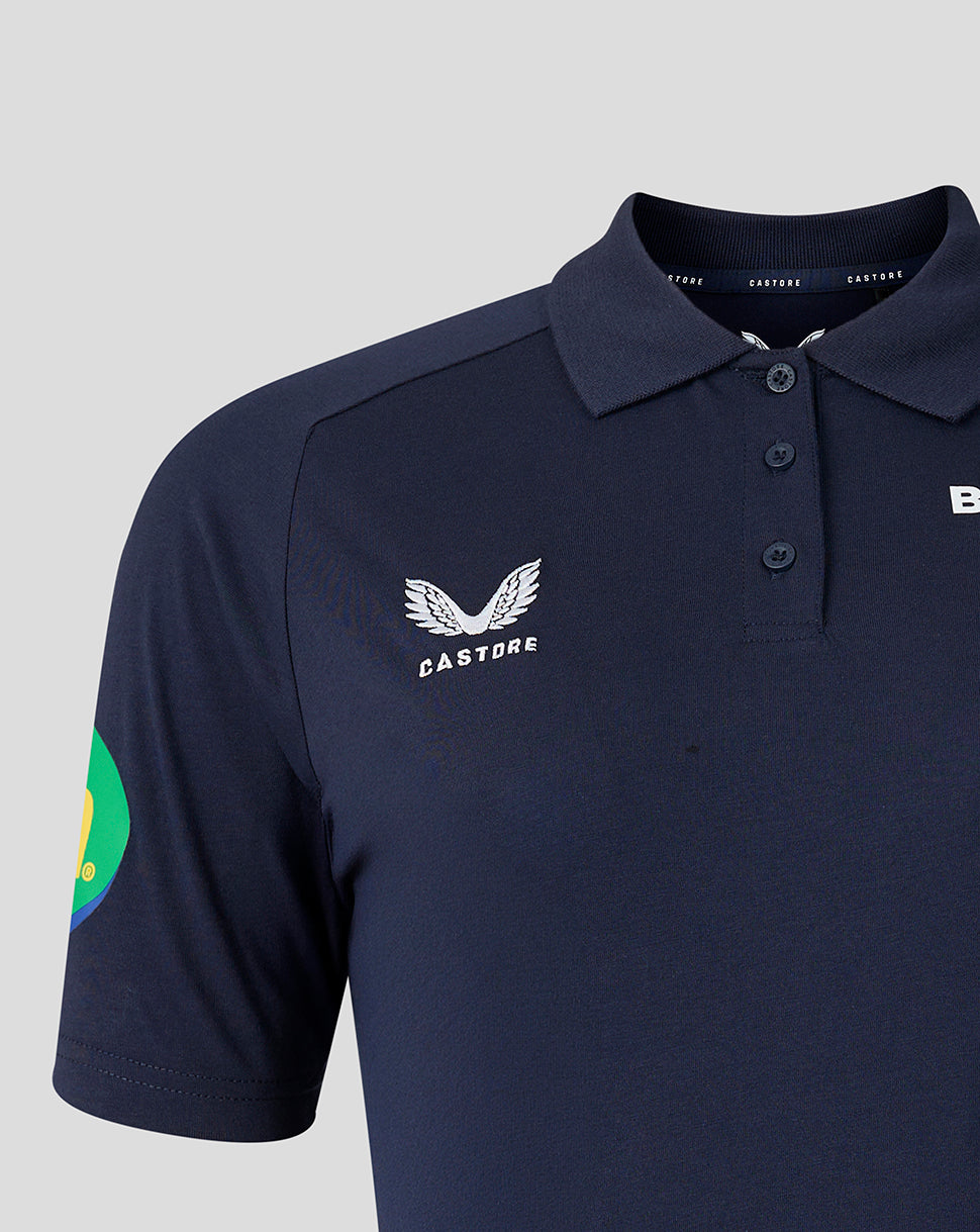 Close up of navy polo collar with three buttons and Castore branding at the neck.