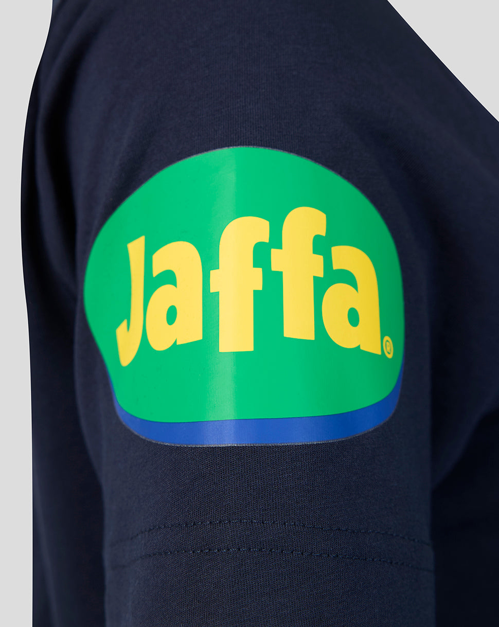 Navy travel T shirt sleeve with bright green circular patch and yellow Jaffa lettering