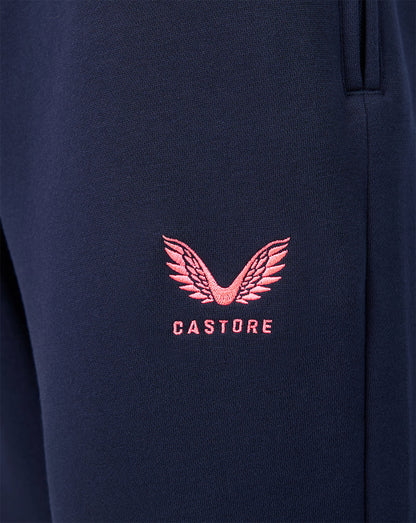 Navy fabric close up with pink Castore logo embroidery on the leg