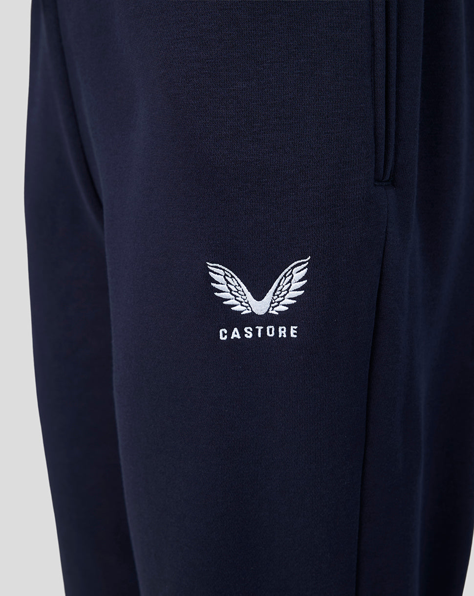 Navy travel joggers with white Castore wing logo embroidered on the thigh