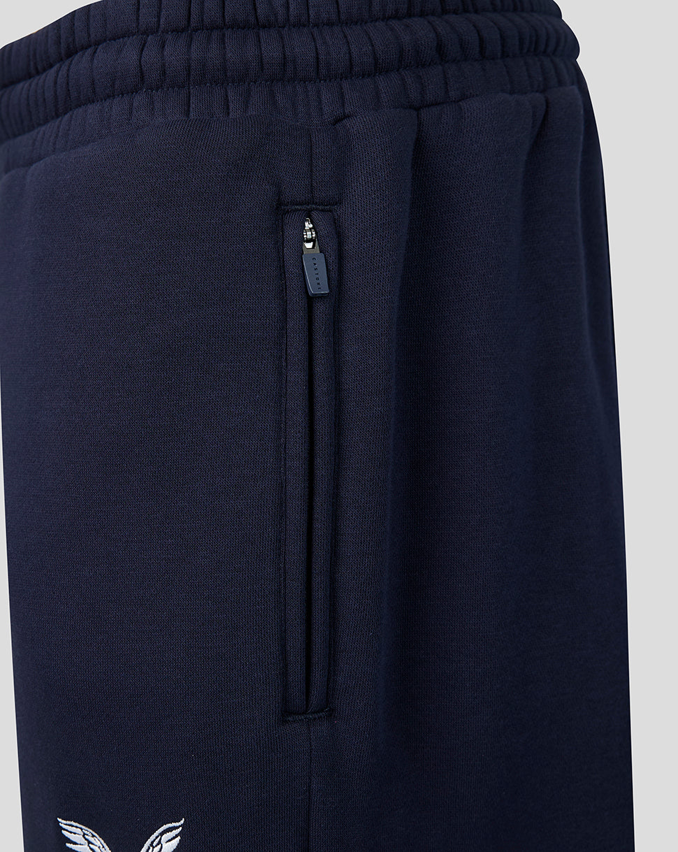 Navy joggers showing a vertical zip pocket and Castore branded zipper pull