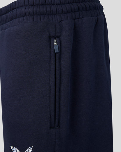 Navy joggers showing a vertical zip pocket and Castore branded zipper pull