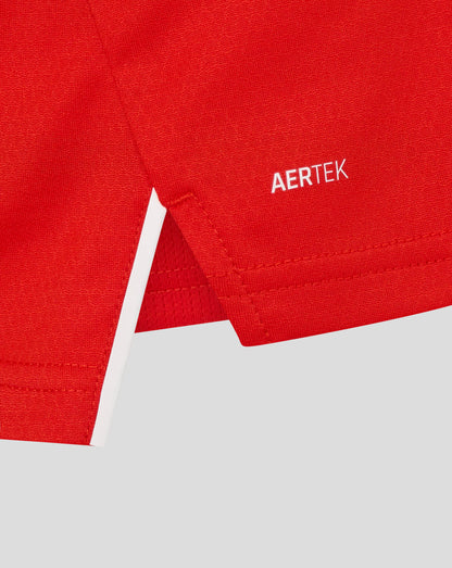 Close-up of red England women's T20 Pro shirt fabric with stitching and AERTEK branding