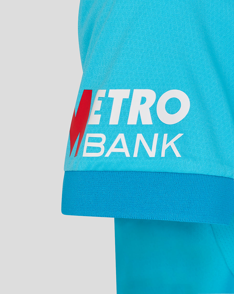 Close-up of a turquoise sports outfit with Metro Bank logo
