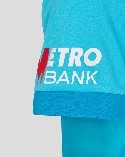 Close-up of a turquoise sports outfit with Metro Bank logo