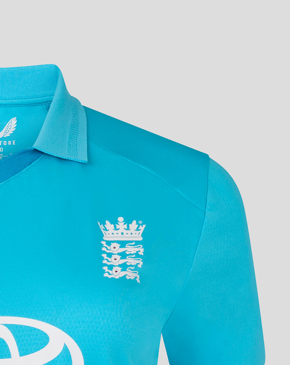 Close-up of a turquoise sports jersey with a logo on a light gray background