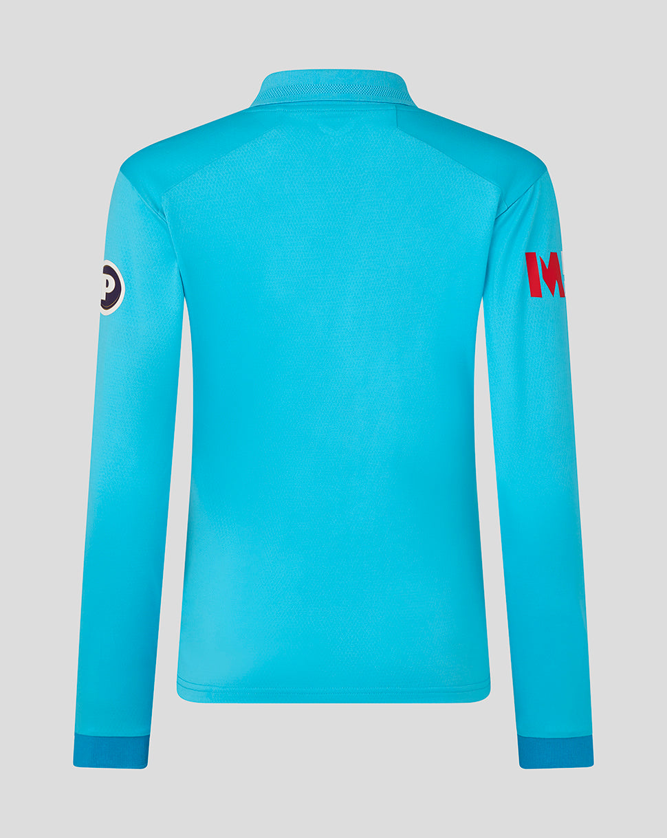 Blue long-sleeve shirt with branding on a gray background