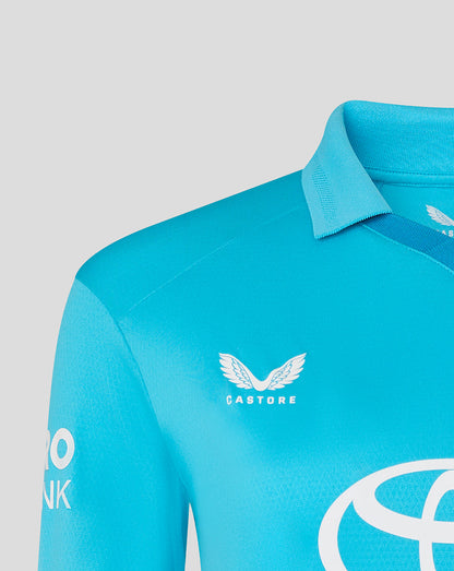 Close-up of a blue sports jersey with logos on a gray background