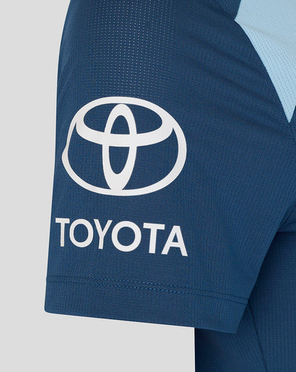 Close-up of a blue sports outfit with Toyota logo on a light gray background