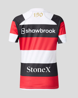 The back of a short-sleeve rugby jersey with horizontal red, white, and black stripes, featuring the Shawbrook and StoneX sponsor logos, a gold '150' print on the neck, and a white collar, shown on a light gray background.