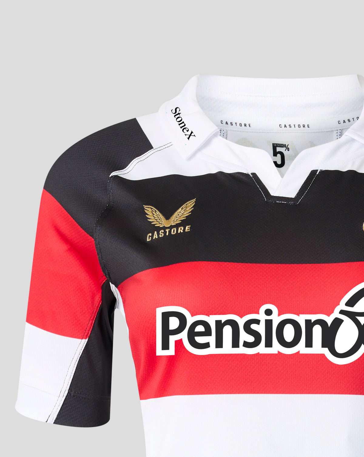 Close-up of a Castore rugby jersey with a black, red, and white color-blocked design, featuring a gold winged logo and a large red and white Pension 65 sponsor logo on the front.