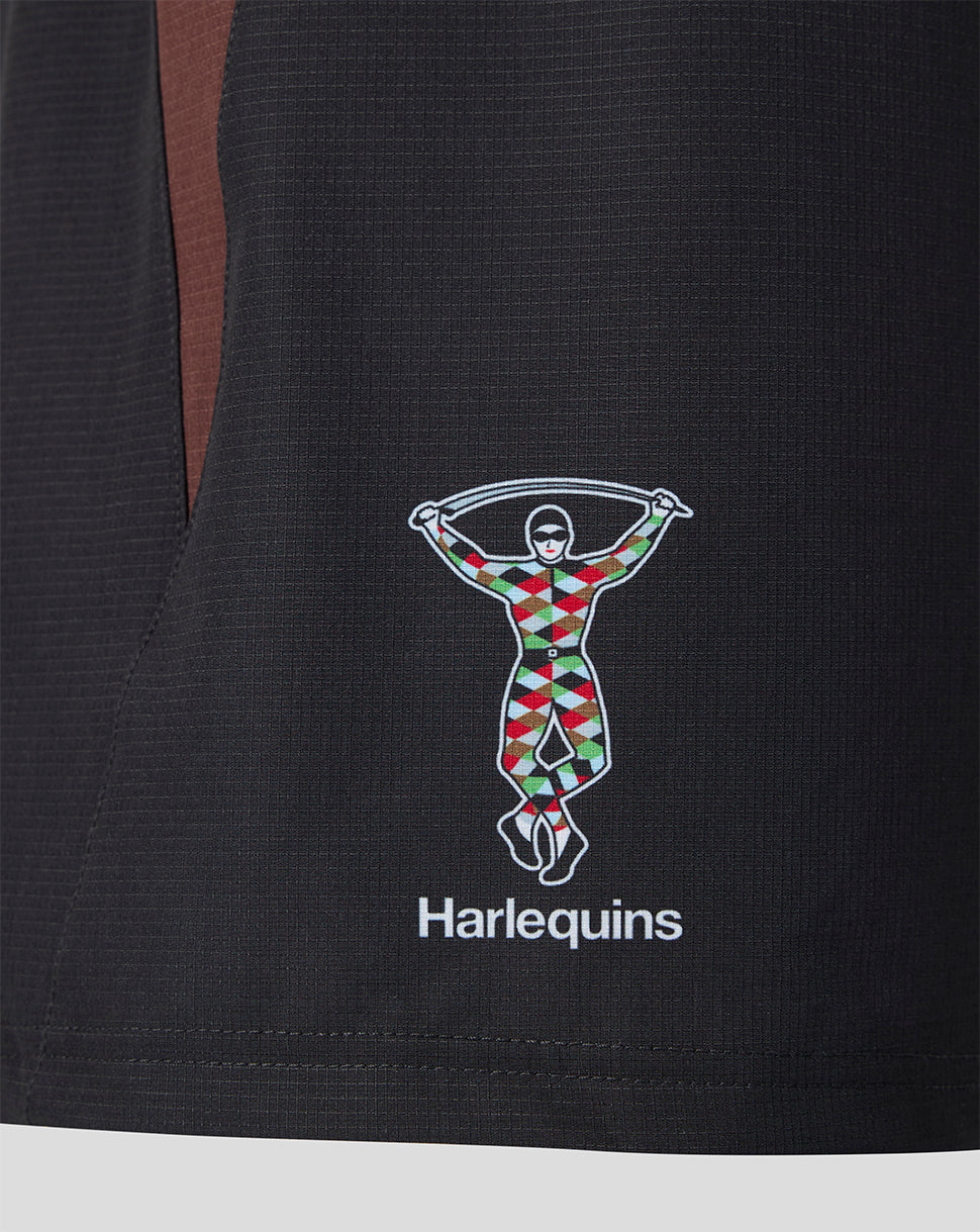 Close-up of the Harlequins logo on the shorts featuring the colorful figure and the Harlequins text