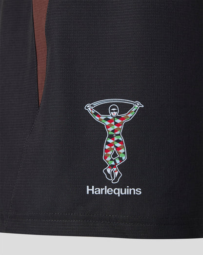 Close-up of the Harlequins logo on the shorts featuring the colorful figure and the Harlequins text