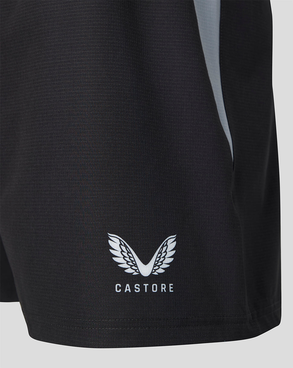 Close up of black Harlequins women's 2026/27 Home Pro Shorts fabric with Castore logo at hem.