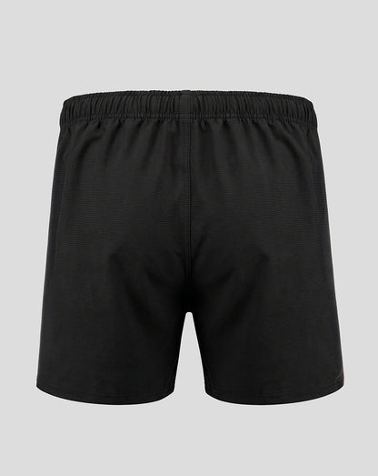 Black athletic shorts with an elastic waistband, shown from the back on a light gray background.