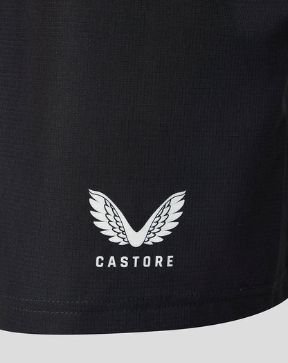 Close-up of a black athletic garment featuring a white Castore wing logo and brand name printed on the front.