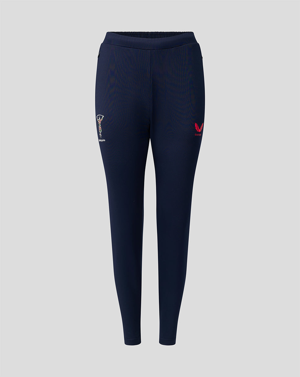 Front view of navy Harlequins training pants with zipped side pockets crest on left thigh