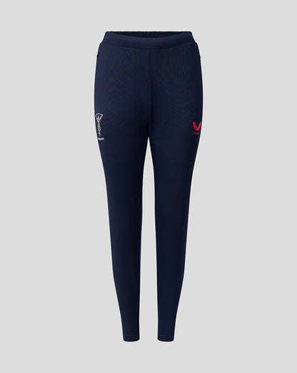Front view of navy Harlequins training pants with zipped side pockets crest on left thigh