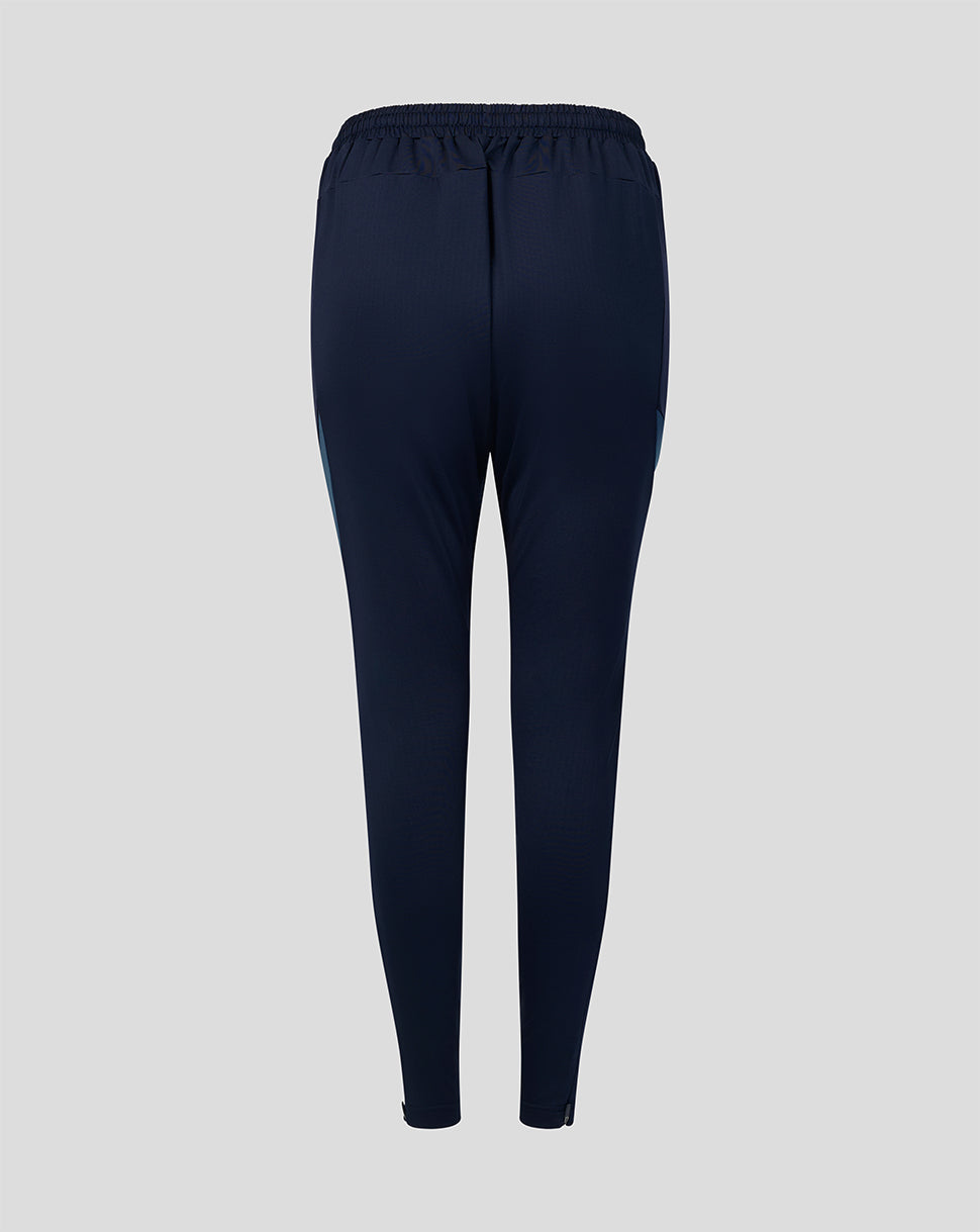 Back view of navy Harlequins training pants with elastic waistband and tapered legs